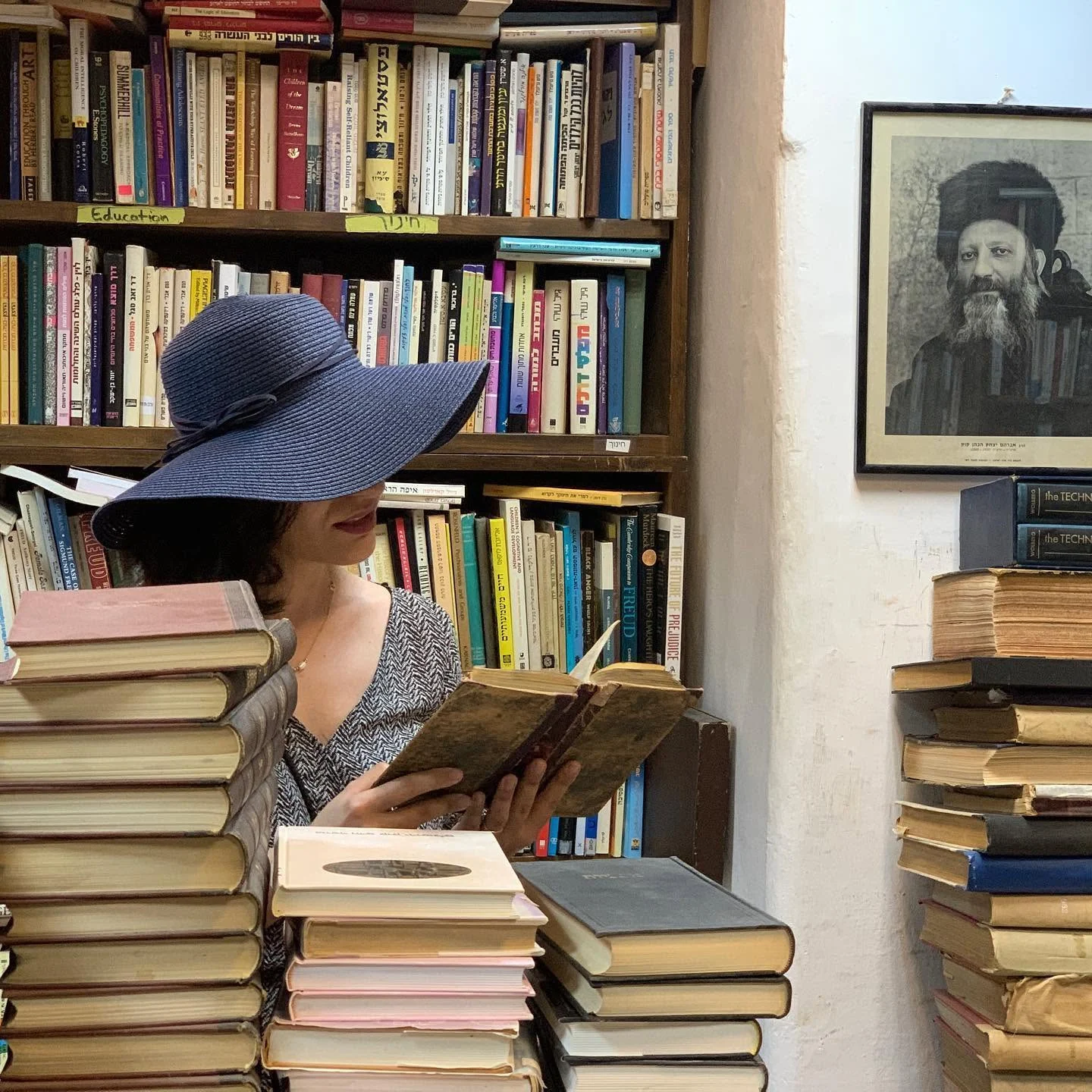 Nelli reading among books